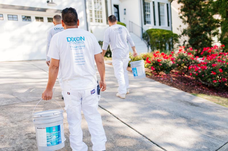 Dixon Painting workers in customer's driveway