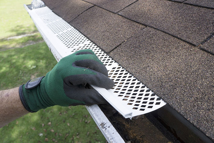 a person holding a gutter