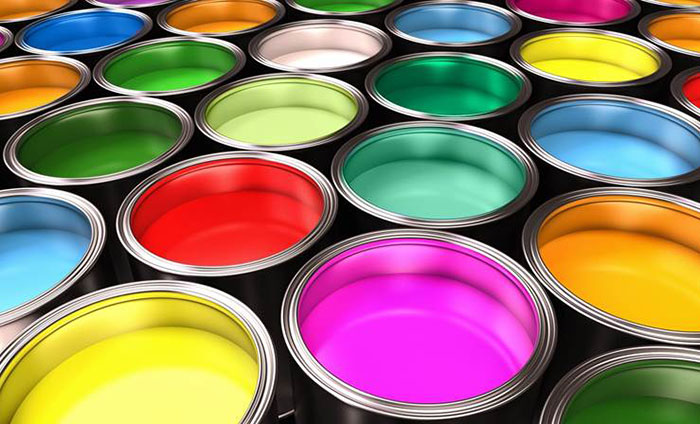 A collection of paint cans filled with a variety of vibrant colors