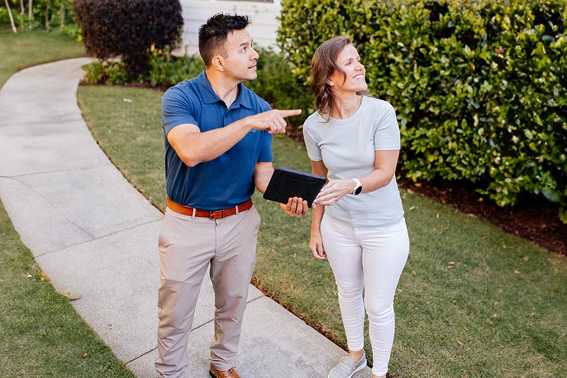 woman talking to Dixon Painting representative